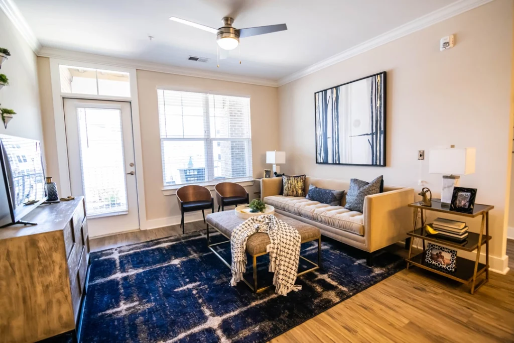 staged living room with large windows and patio door